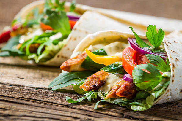 istock Mexican tortillas filled with meat, salad and dressing 453909635