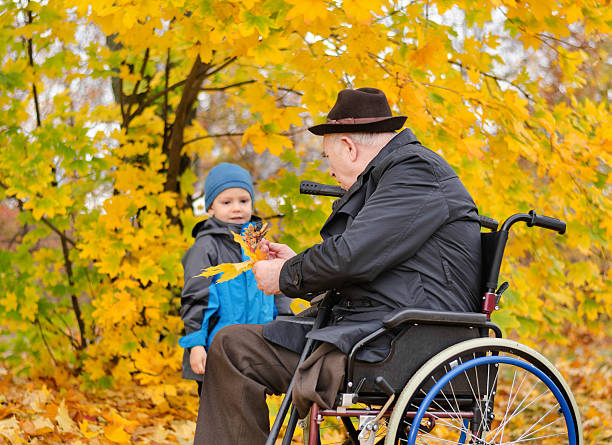 istock Elderly disabled man playing with his grandson 453910129