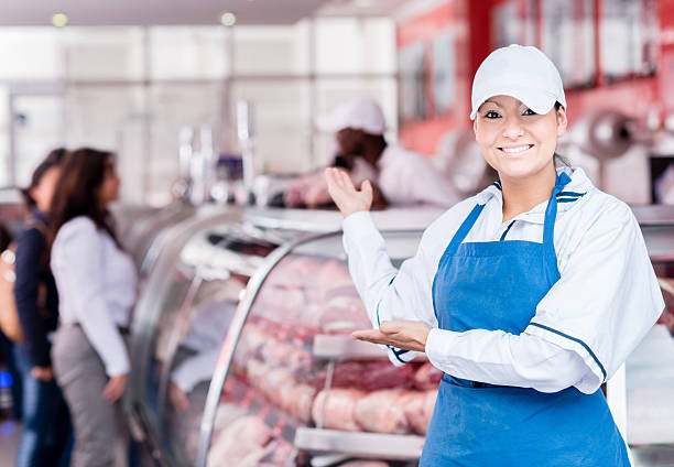 welcoming woman butcher - industry food butcher butchers shop 뉴스 사진 이미지
