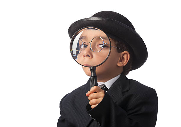 istock Little detective looking through magnifying glass 453918351