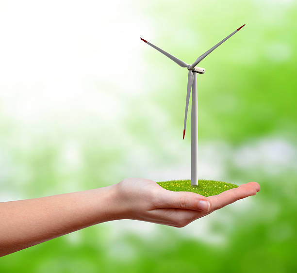 istock wind turbine in hand 453920589