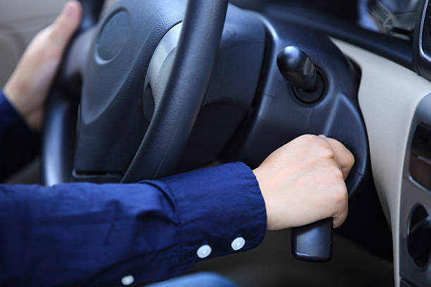 istock A person turning the key in the car ignition  453926785