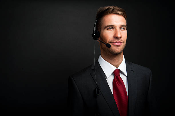 Smiling customer service operator. Over white background stock photo