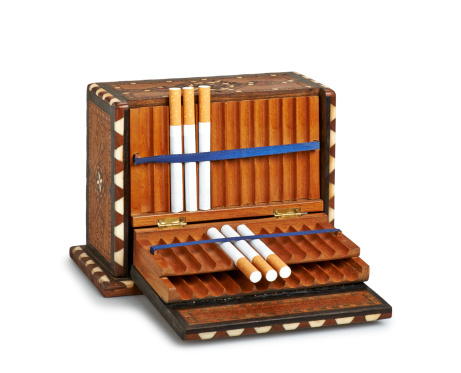 Cigarettes in old wooden box (clipping path )