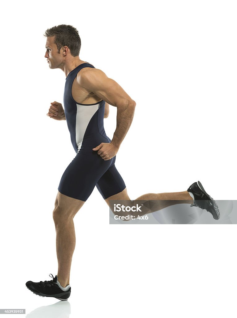 Man jogging wearing sports uniform Man jogging wearing sports uniformhttp://www.twodozendesign.info/i/1.png 20-29 Years Stock Photo