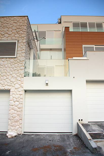istock Modern architecture exterior detail with garage doors 453938837