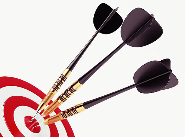 istock Black darts on bullseye of red target 453938991