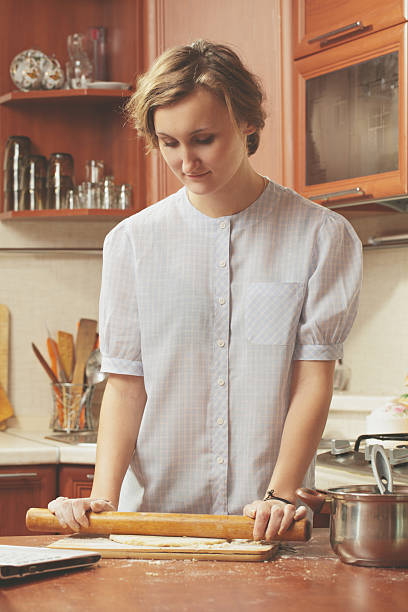 istock young woman in the kitchen 453946205