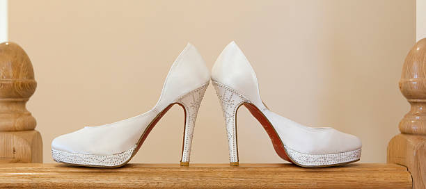 istock brides shoes placed on a handrail 453950895