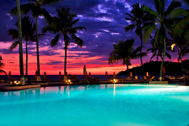 istock swimming pool sunset in nosy be 453952875