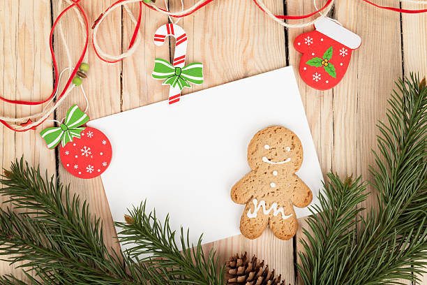 istock Christmas fir tree, gingerbread cookies and card for copy space 453954425
