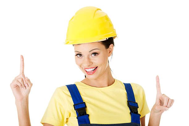 istock Attractive woman wears work clothes and helmet. 453956925