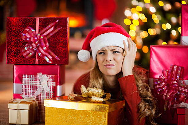 istock Worried woman surrounded by Christmas presents. 453959135