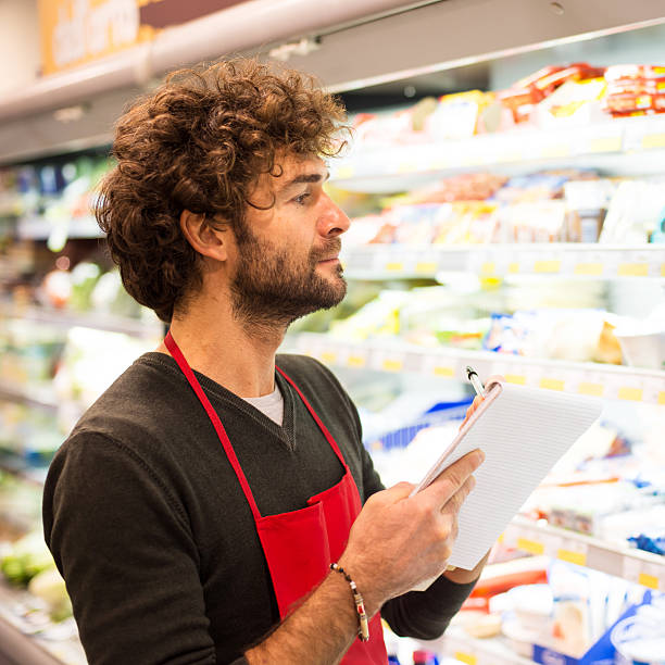 istock Supermarket Sales Clerk Checking Products 453962287