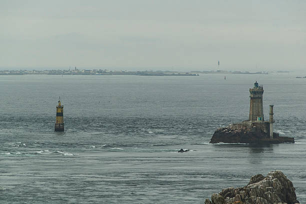 lighthouse Lighthouse located on the coast of Pont du Raz in Brittany. tarde stock pictures, royalty-free photos & images