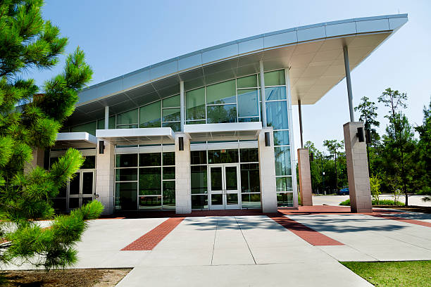 Education:  University building on campus. Or modern office. Modern stylish building on university campus.  Or modern office.    schoolhouse stock pictures, royalty-free photos & images