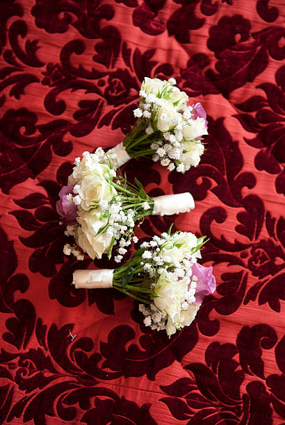 Wedding bouquet arranged on a flowral themed carpet