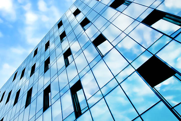 istock beauty reflection of cloudy sky in modern glass windows 453970091