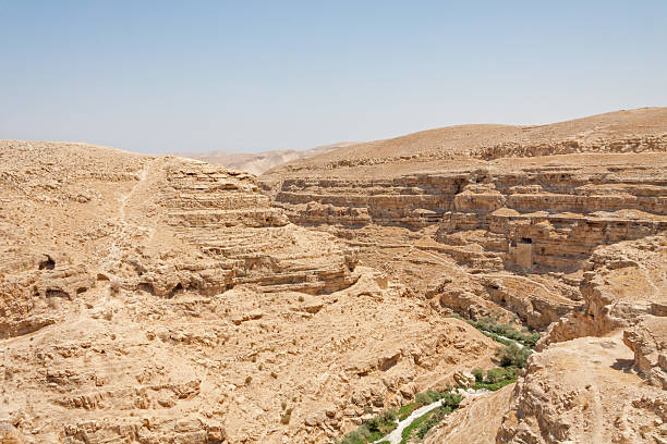 istock Kidron river canyon with cave monk cell in steep wall 453971885