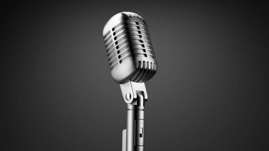 Old Chrome Microphone isolated on black background