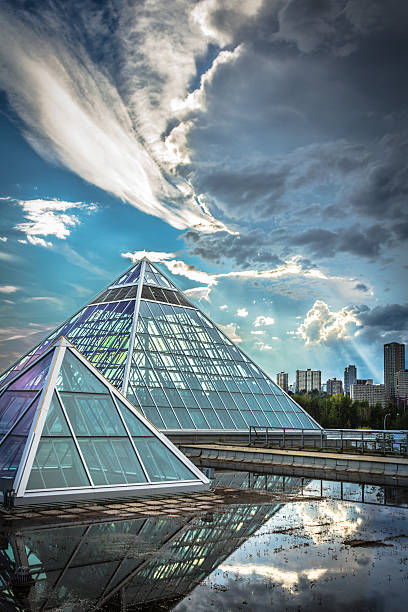 istock Overview of glass pyramids against cloudy skies 453977671