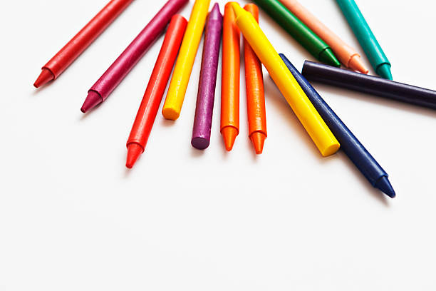 istock Rainbow of wax crayons scattered on white background 453982329