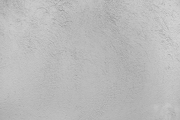 Background texture of a stucco wall in gray stock photo