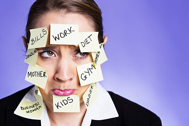 istock Pouting woman wearing many  task reminders hates multitasking! 453989453