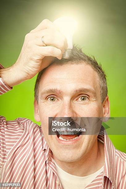 Foto de Homem Com Lâmpada e mais fotos de stock de Adulto - Adulto, Aspiração, Braço humano