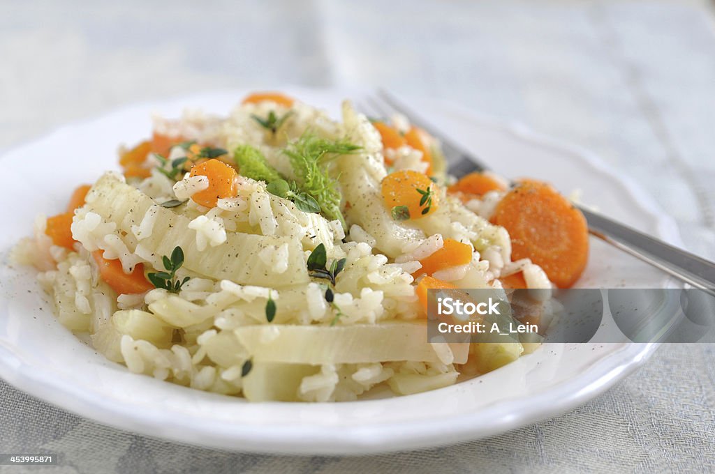 Risotto with carrots and fennel Basil Stock Photo