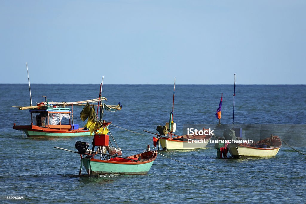 Fishing Boat in sea waves gently Fishing Boat in sea waves  in Gulf of Thailand After Work Stock Photo