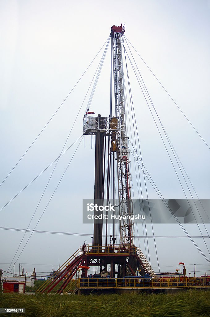 Oil derrick Oil derrick on background of sky Blue Stock Photo