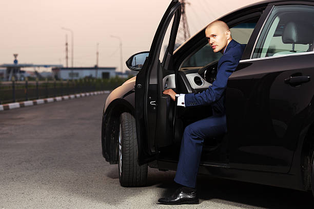 istock Young businessman sitting in the car 454030909