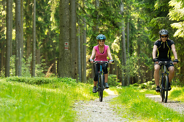 istock Cheerful biker couple in woods 454049323