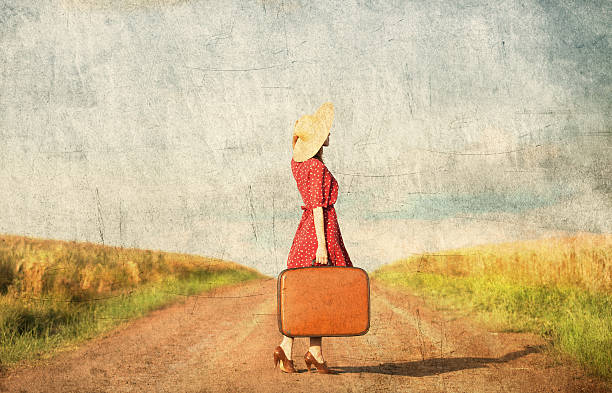 istock Redhead girl with suitcase at outdoor. 454056107