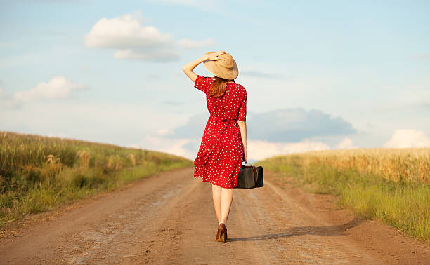 istock Redhead girl with suitcase at outdoor. 454056231