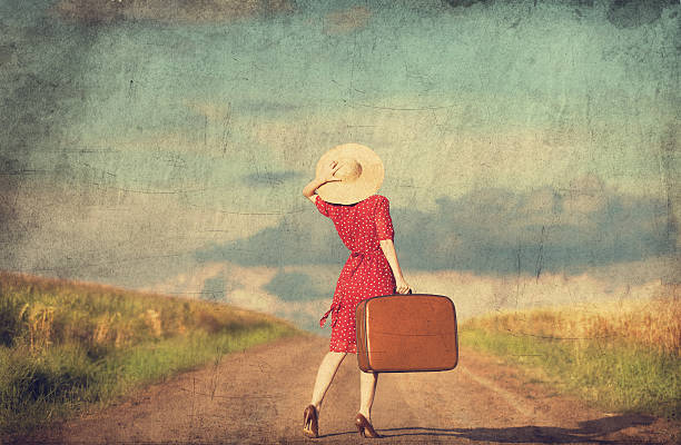 istock Redhead girl with suitcase at outdoor. 454056253