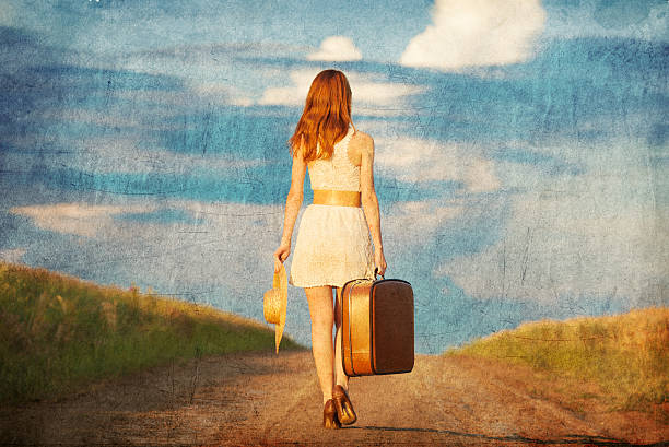 istock Redhead girl with suitcase at outdoor. 454056395