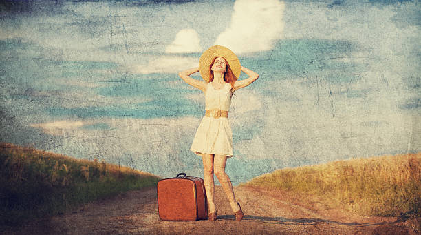 istock Redhead girl with suitcase at outdoor. 454056417