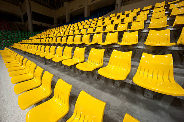istock Yellow plastic seats at Basketball stadium . 454057047