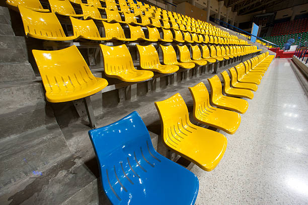istock Plenty of plastic seats at stadium . 454057049
