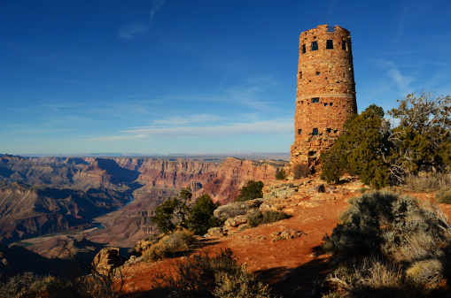 Colter-designed 1930's Desert Watchtower overlooking the canyon gorge and Colorado River in Grand Canyon National Park, Arizona, USA.