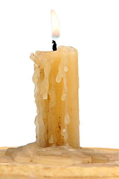 old candle isolated on a white background stock photo