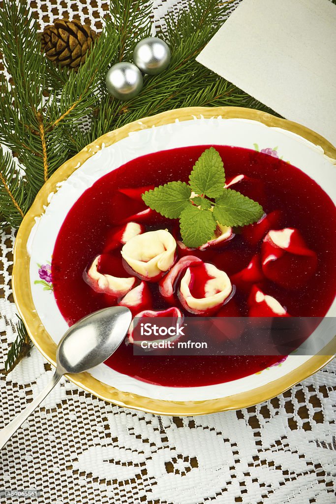 Traditional Christmas borscht with mushrooms filled in dumplings Beet Stock Photo