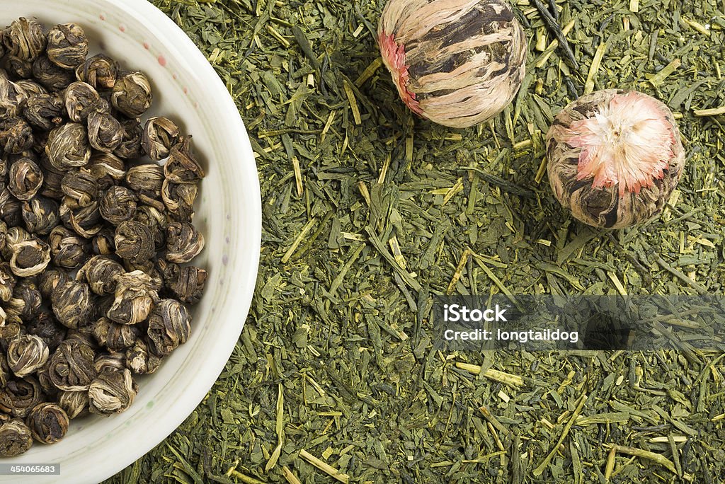 Green tea set Dried green tea leaves, ball flower tea, and green pearl balls tea background Antioxidant Stock Photo