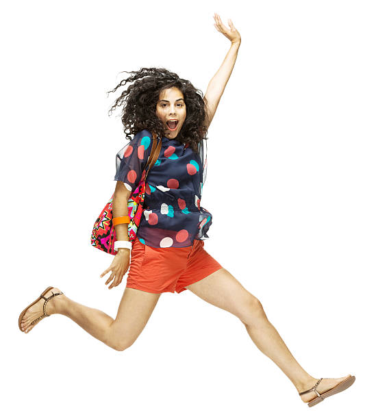 istock Women jumping holding bag on shoulder 454096931