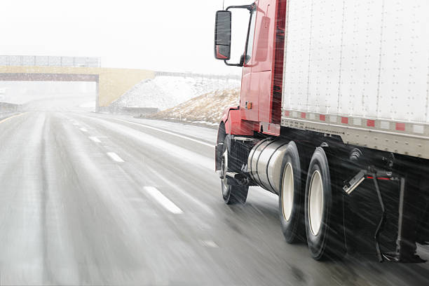 istock Semi-truck on Snowy Interstate 454097475