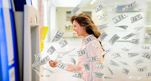 istock Woman withdrawing money from an ATM 454097589