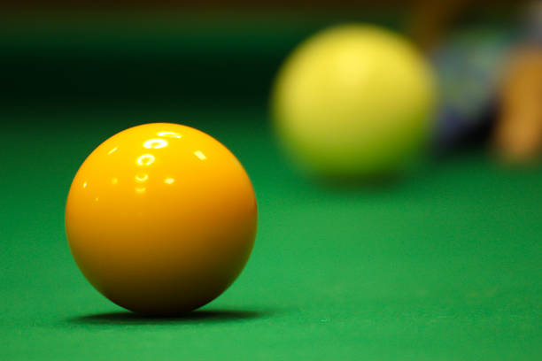 The man playing billiards