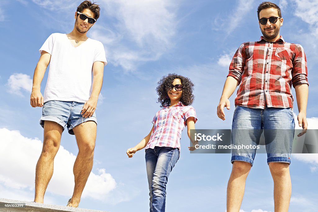 Stylish teens Three happy young people in summer 16-17 Years Stock Photo